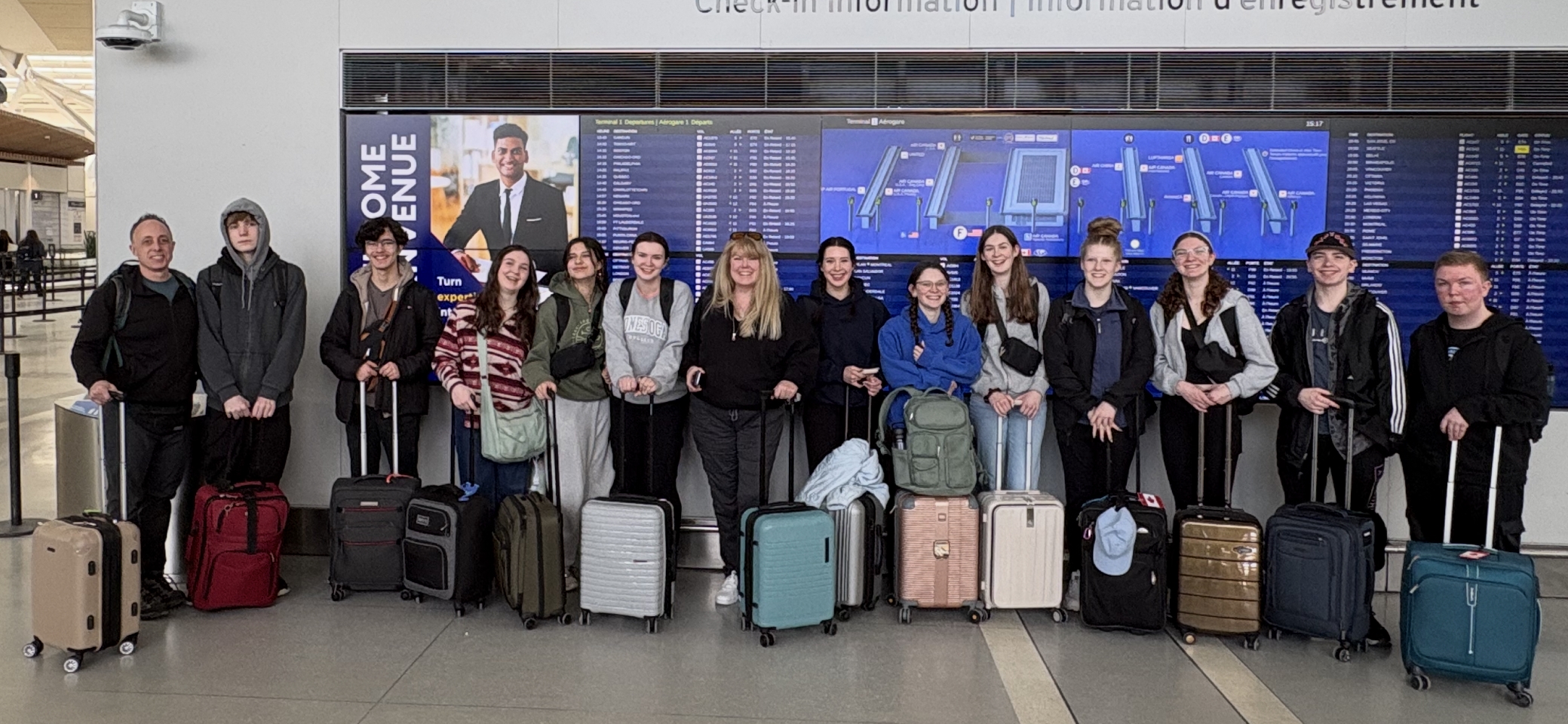 Students at the airport ready for their adventure